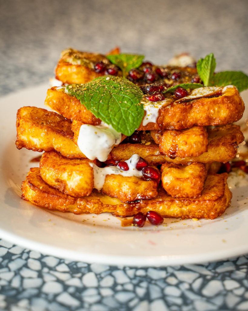 Notorious Espresso Haloumi Fried with Pomegrante and Yoghurt with Mint on Top, Close up, on plate