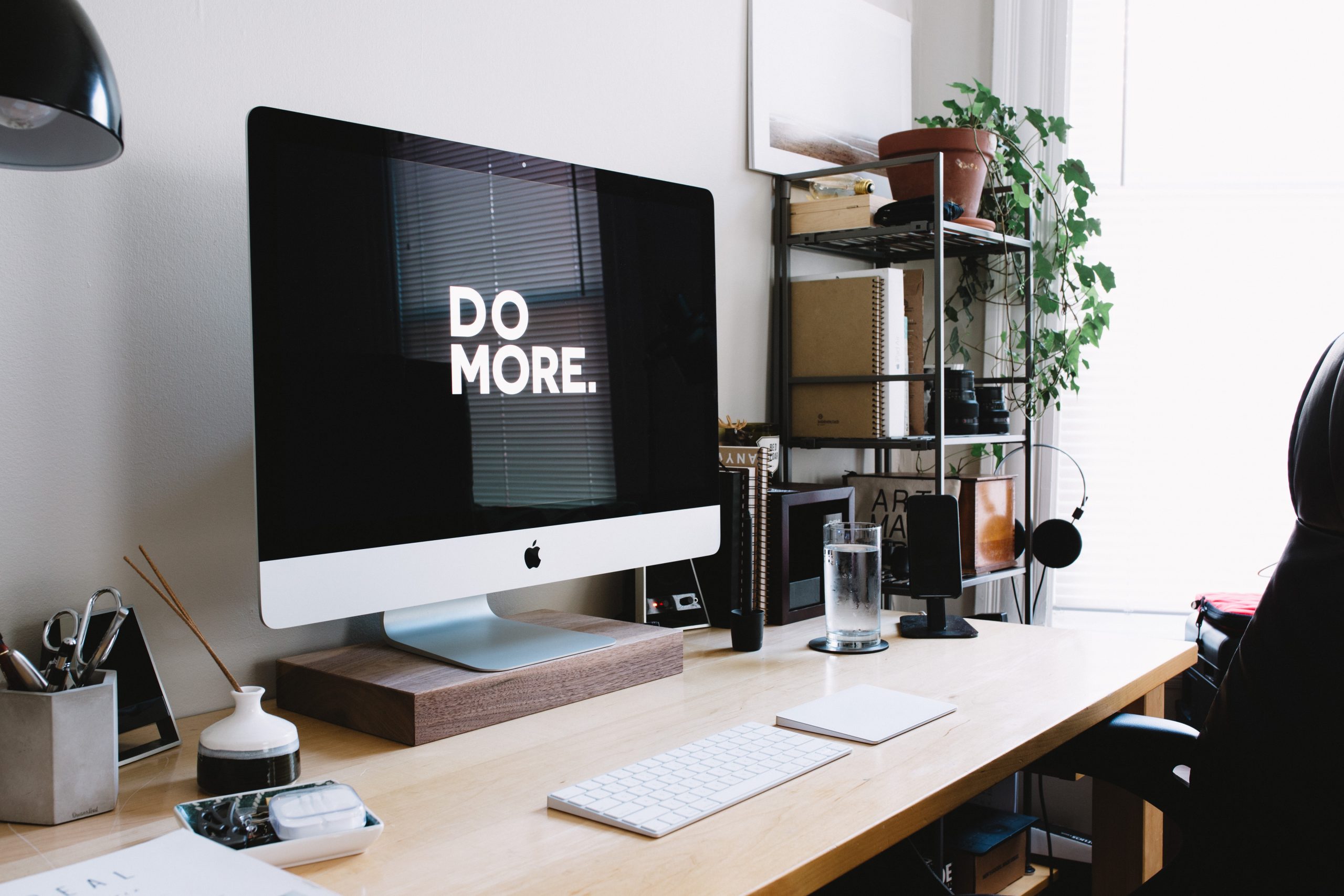 Desktop table macbook minimalist, Do More. written on the monitor